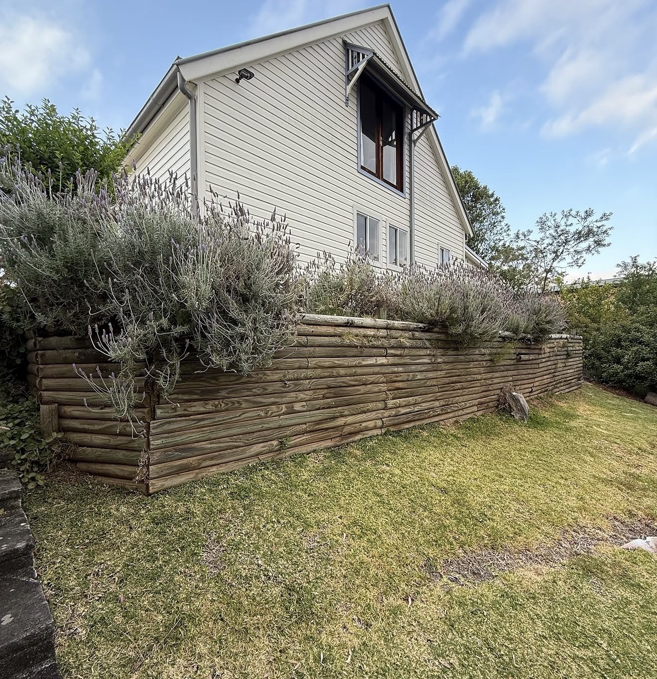 Failed timber sleeper retaining wall before sandstone replacement - Hawkesbury NSW